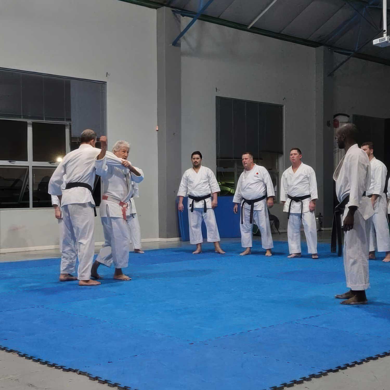 Sensei Alfie teaching Judo basics to a karate class